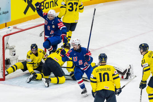 Clayton Keller and Conor Garland of USA celebrate