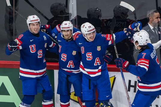 Zach Werenski, Matty Beniers, Michael Eyssimont and Michael