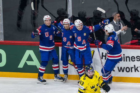 Zach Werenski, Matty Beniers, Michael Eyssimont and Michael