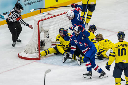 Clayton Keller and Conor Garland of USA celebrate