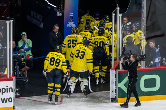 Players of Sweden leave the ice