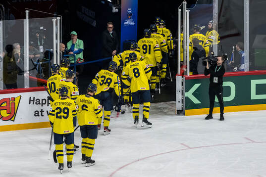 Players of Sweden leave the ice