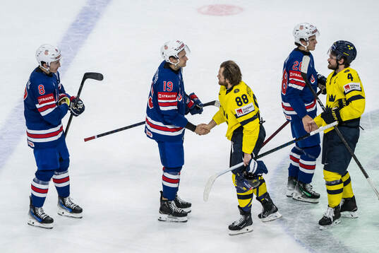 William Nylander and Rasmus Andersson of Sweden with Zach
