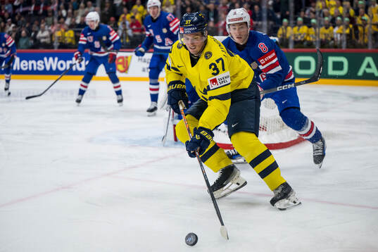 Isac Lundeström of Sweden and Zach Werenski of USA