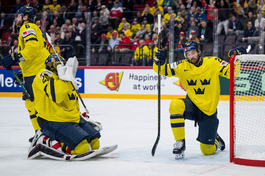 Goaltender Jacob Markström and Elias Lindholm of Sweden
