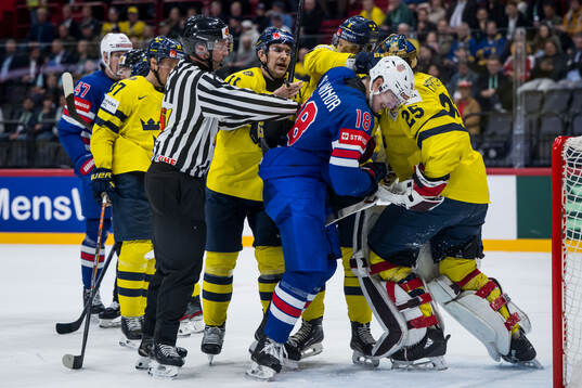 Mikael Backlund and Adam Larsson of Sweden against Drew