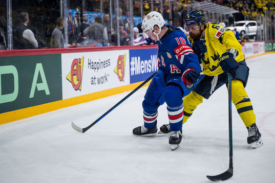 Drew O'Connor of USA and Adam Larsson of Sweden