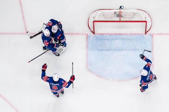 Shane Pinto, goaltender Jeremy Swayman, Jackson LaCombe and