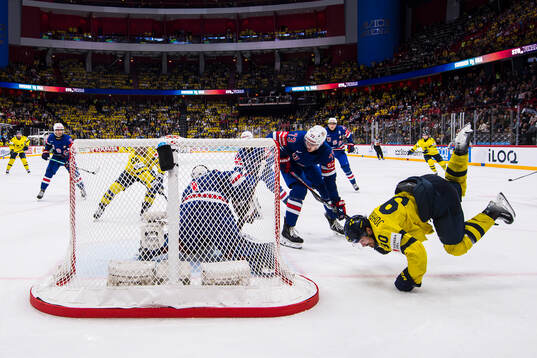 Goaltender Jeremy Swayman, Alex Vlasic of USA and Marcus