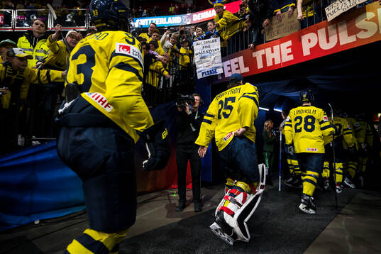 Mika Zibanejad and goaltender Jacob Markström of Sweden