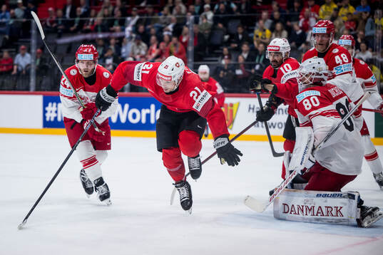 Kevin Fiala of Switzerland against Nikolaj Ehlers and