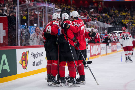 Timo Meier of Switzerland celebrates with teammates