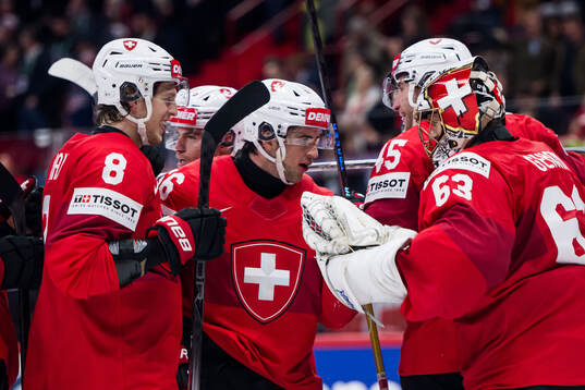 Leonardo Genoni of Switzerland celebrates
