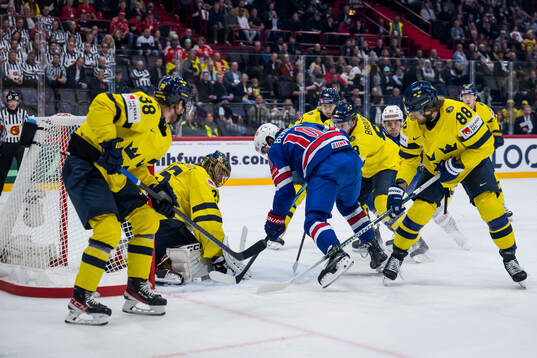 Matty Beniers of USA against goaltender Jacob Markström