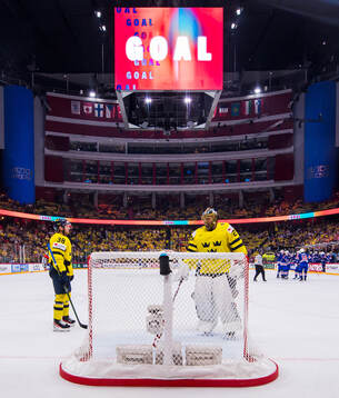 Rasmus Sandin and goaltender Jacob Markström of Sweden