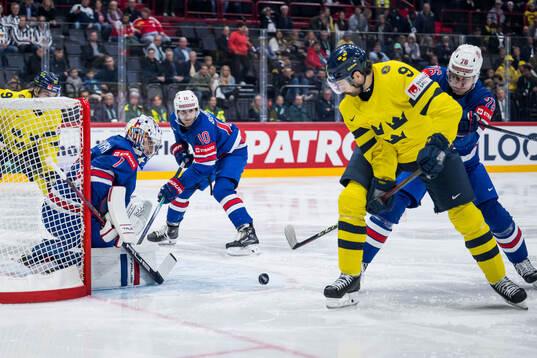 Filip Forsberg of Sweden and goaltender Jeremy Swayman of