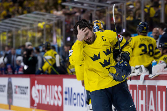 Rasmus Andersson of Sweden looks dejected