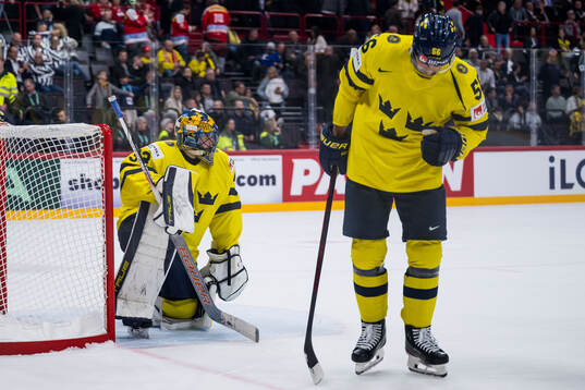 Goaltender Samuel Ersson and Erik Gustafsson of Sweden