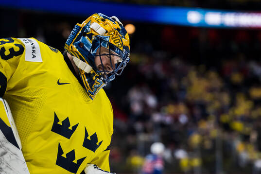 Goaltender Samuel Ersson of Sweden looks dejected