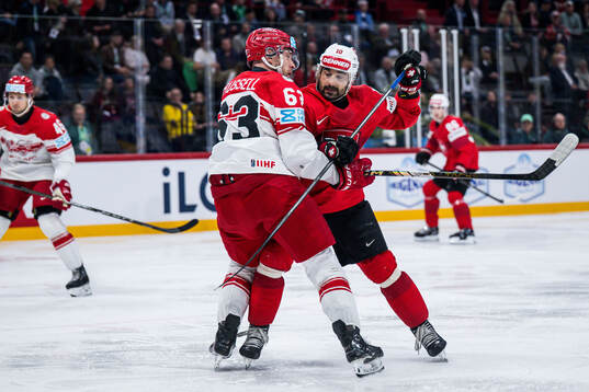Patrick Russell of Denmark and Andres Ambuhl of Switzerland