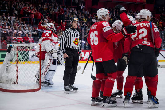 Goaltender Jesper Jensen Aabo of Denmark looks dejected