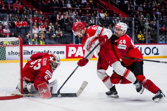Patrick Russell of Denmark against goalkeeper Leonardo