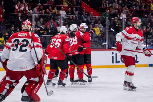 Christoph Bertschy and Damien Riat of Switzerland celebrate