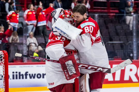 Goaltender Sebastian Dahm and goaltender Frederik Dichow of