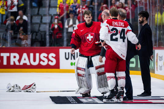 Goaltender Leonardo Genoni of Switzerland and Nikolaj