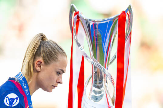 Fridolina Rolfö of Barcelona walks past the trophy