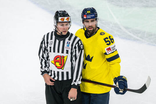 Erik Gustafsson of Sweden with linesman Shane Gustafson