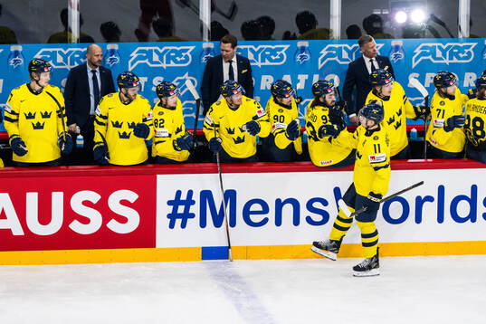 Mikael Backlund of Sweden celebrates with team mates