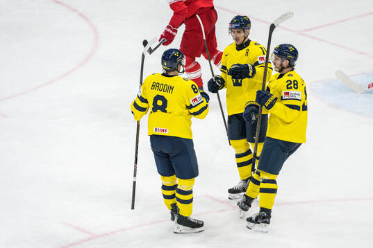 Mikael Backlund of Sweden celebrates with Jonas Brodin and