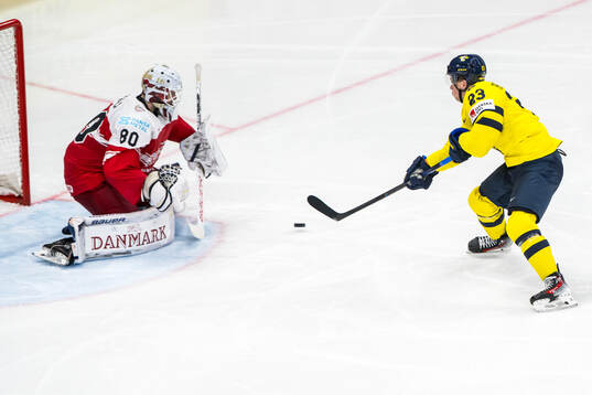 Lucas Raymond of Sweden scores 4-0 past goaltender Frederik