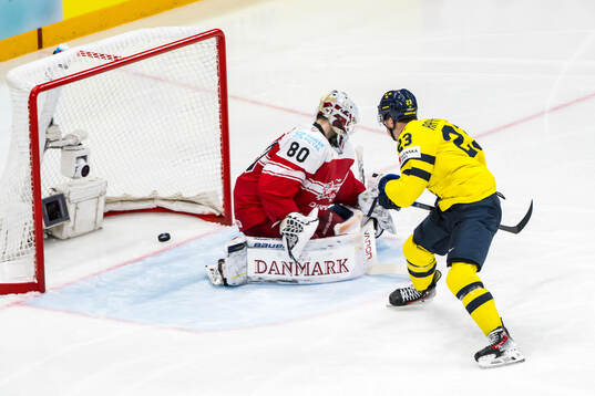 Lucas Raymond of Sweden scores 4-0 past goaltender Frederik