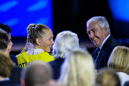Kim Martin-Hasson of Sweden and IIHF president Luc Tardif