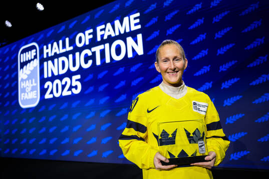 Kim Martin-Hasson of Sweden poses with her induction trophy