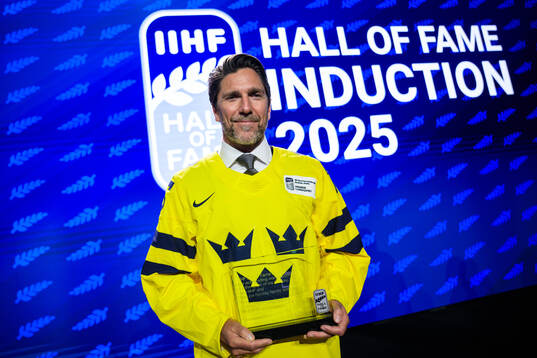 Henrik Lundqvist of Sweden poses with his induction trophy