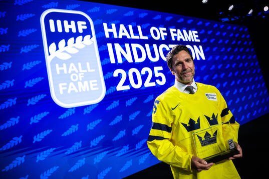 Henrik Lundqvist of Sweden poses with his induction trophy