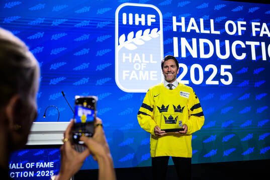 Henrik Lundqvist of Sweden poses with his induction trophy