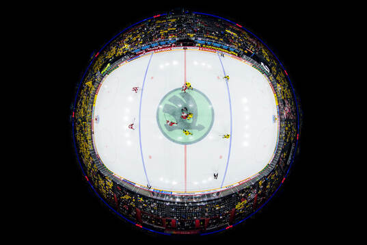 Alexander True of Denmark wins the opening face-off against
