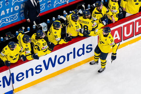 Mikael Backlund of Sweden celebrates with team mates