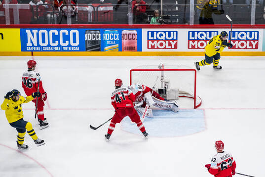 Mikael Backlund of Sweden celebrates with Elias Lindholm