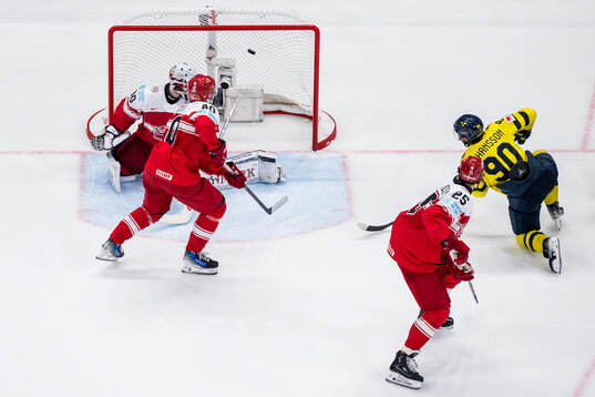 Marcus Johansson of Sweden scores 3-0 past Anders Koch and