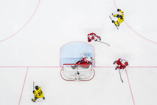 Mikael Backlund of Sweden celebrates with Elias Lindholm