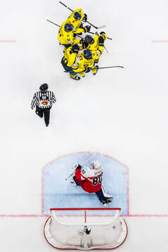 goaltender Frederik Dichow of Denmark looks dejected while