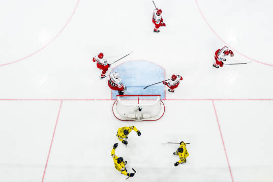 Adam Larsson, Emil Heineman and Mikael Backlund of Sweden