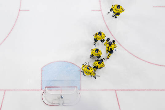 goaltender Samuel Ersson of Sweden with team mates