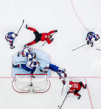 Nino Niederreiter and Kevin Fiala of Switzerland in action