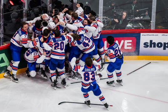 Tage Thompson of USA celebrates with team mates
